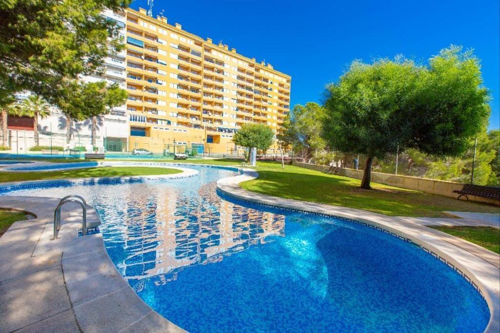 Apartment In Campoamor Overlooking The Swimming Pool Екстериор снимка