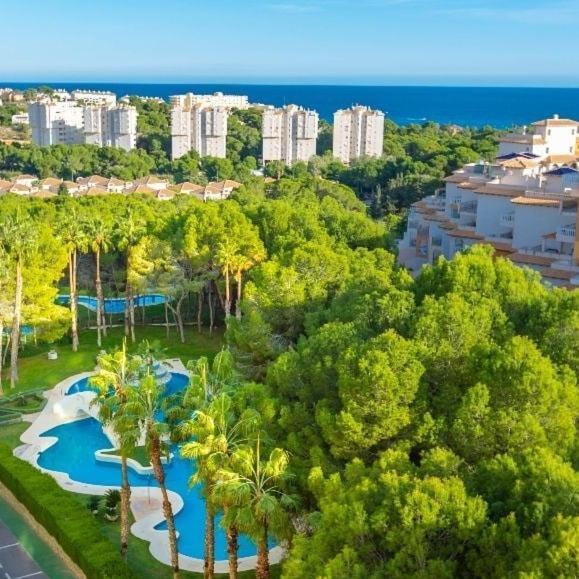Apartment In Campoamor Overlooking The Swimming Pool Екстериор снимка