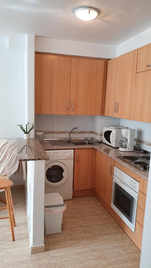 Apartment In Campoamor Overlooking The Swimming Pool Екстериор снимка