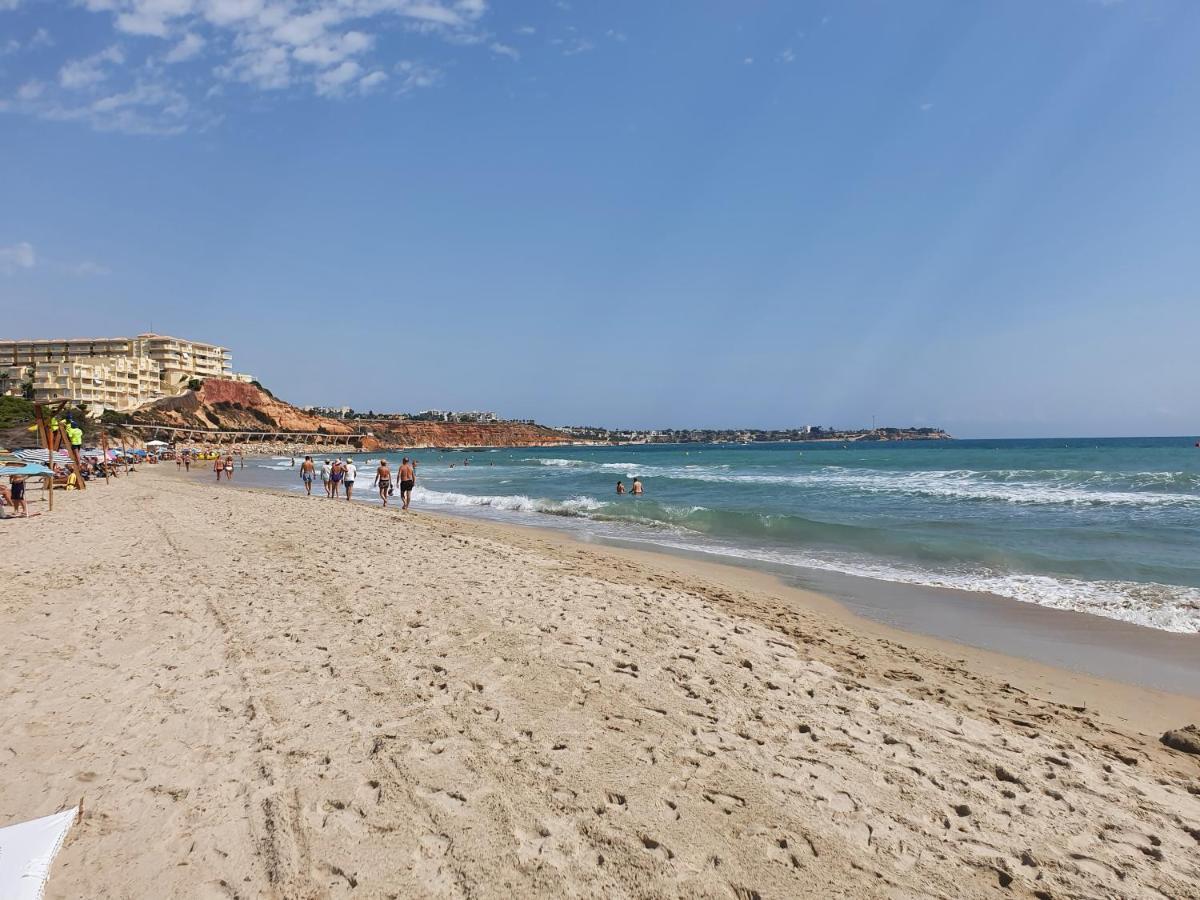 Apartment In Campoamor Overlooking The Swimming Pool Екстериор снимка