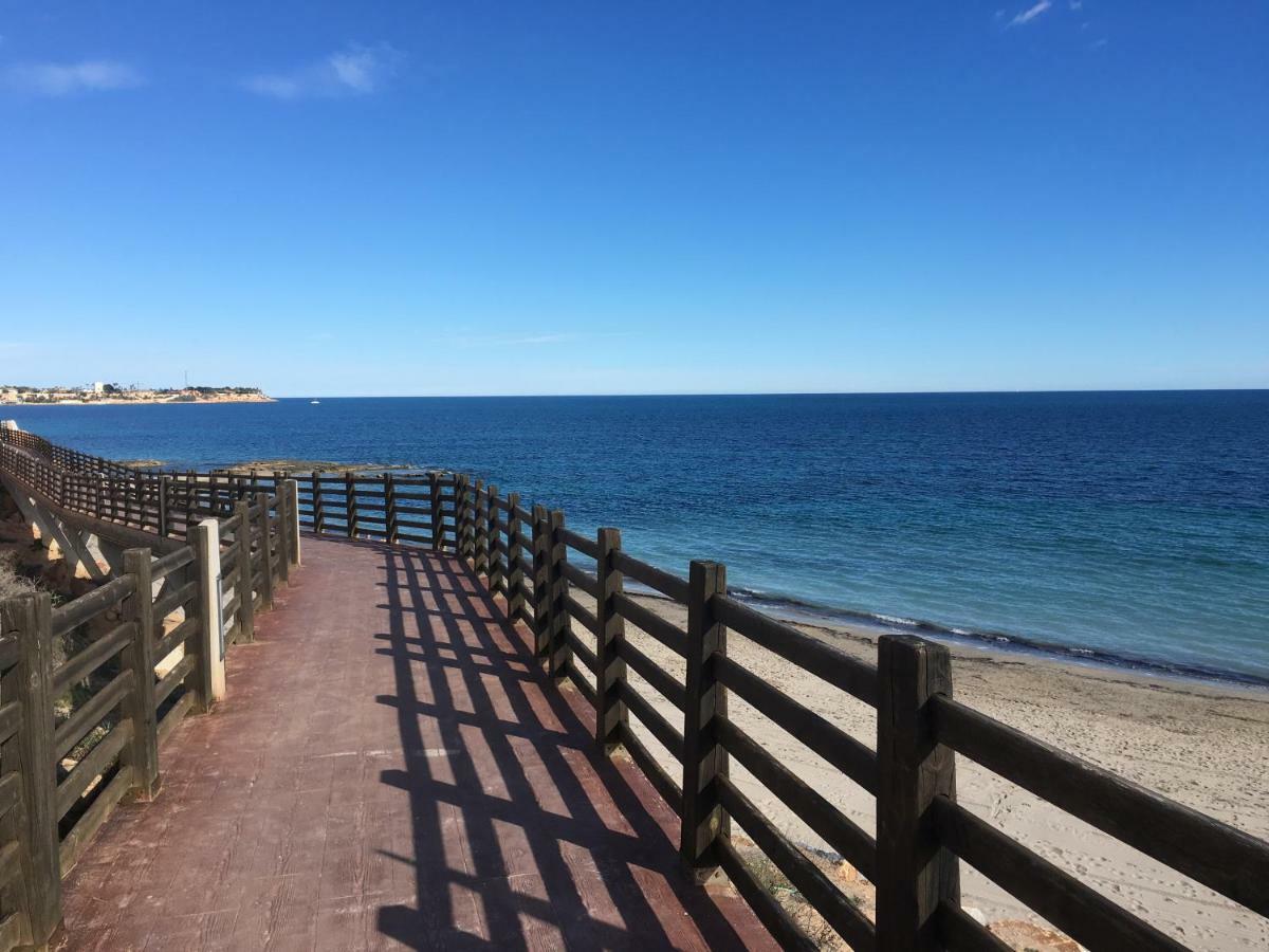 Apartment In Campoamor Overlooking The Swimming Pool Екстериор снимка