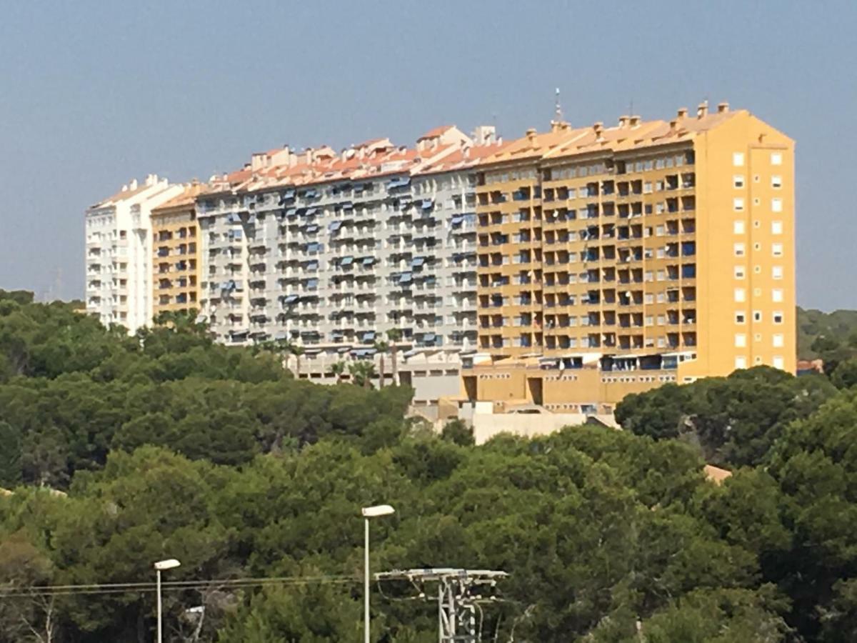 Apartment In Campoamor Overlooking The Swimming Pool Екстериор снимка