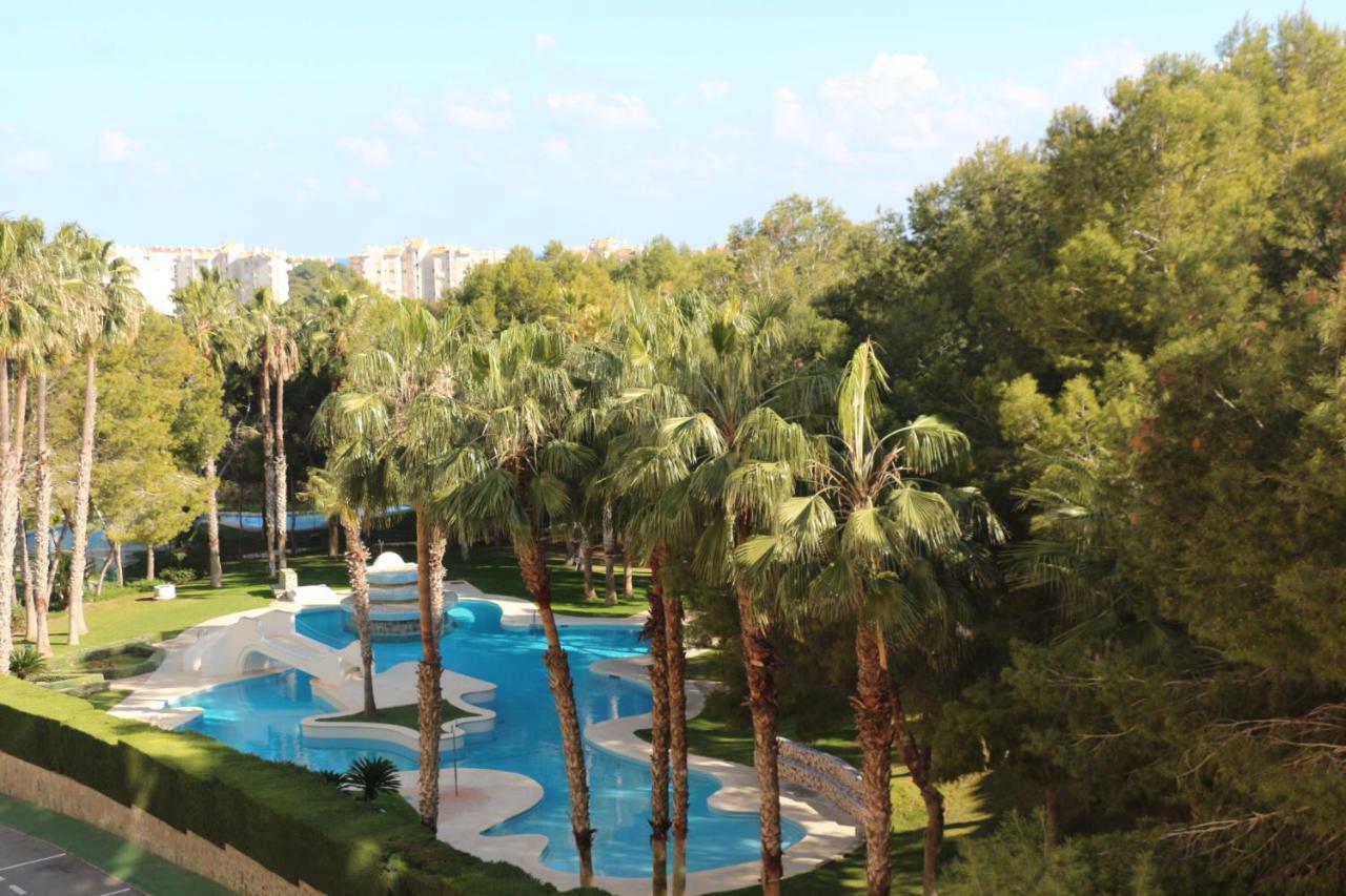 Apartment In Campoamor Overlooking The Swimming Pool Екстериор снимка